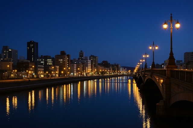 blue-hour-riverfront-arched-bridge-city-lights-japan
